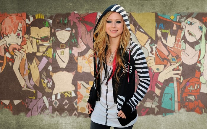 Avril Lavigne in front of anime-style mural