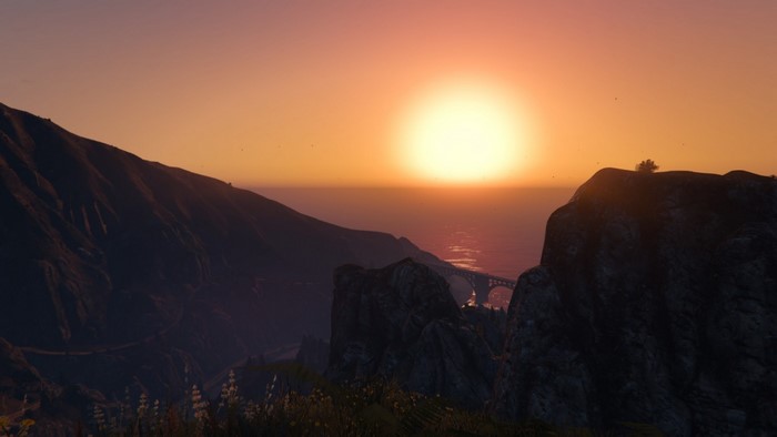 Sunset over mountains and ocean in Grand Theft Auto V