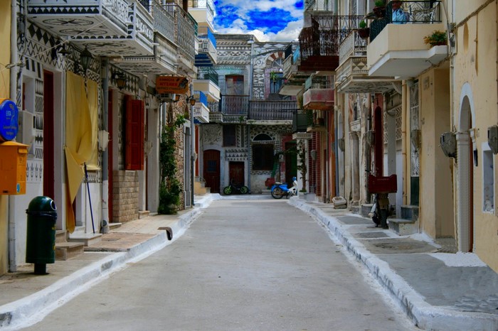 Pyrgi village street with decorated buildings and balconies