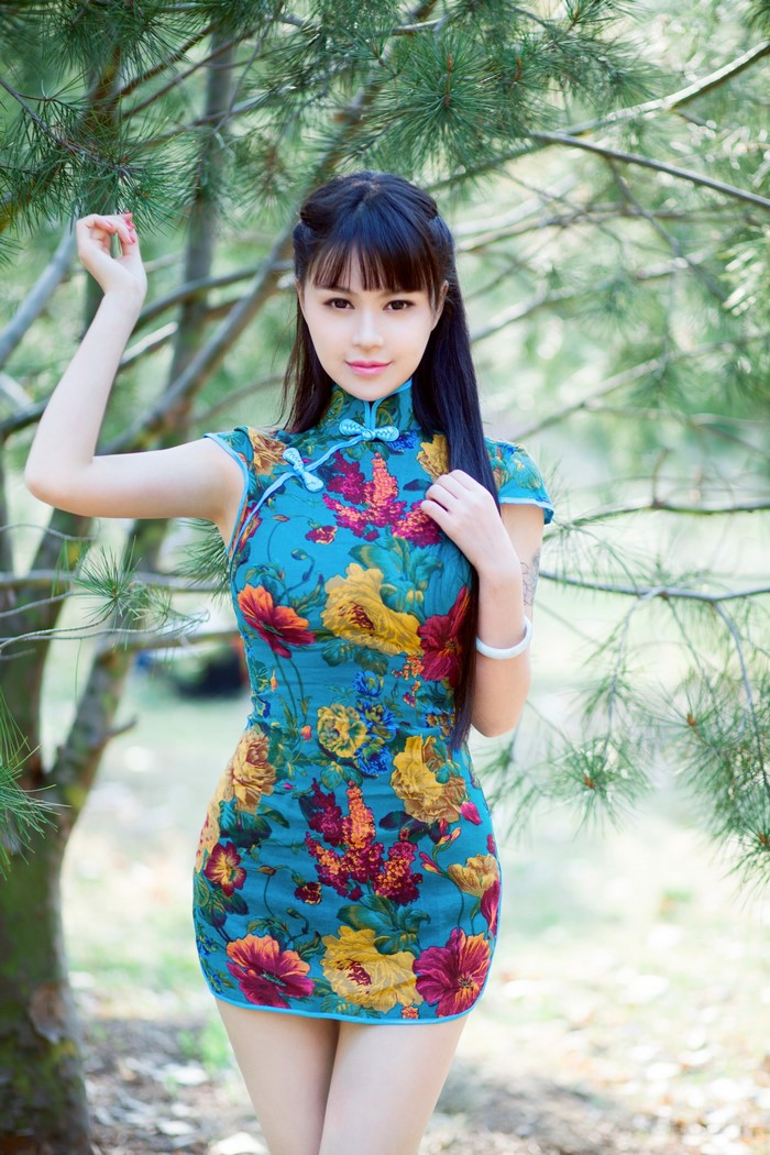 Asian woman in a floral blue dress