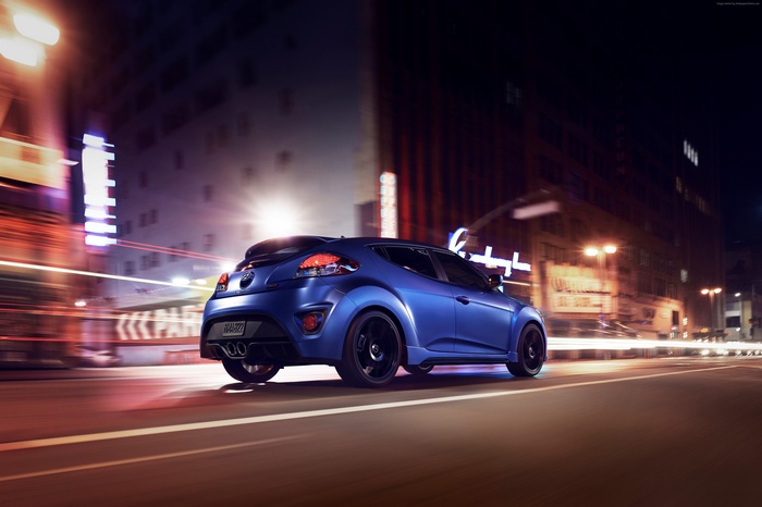 Blue Hyundai Veloster Rally Edition driving at night