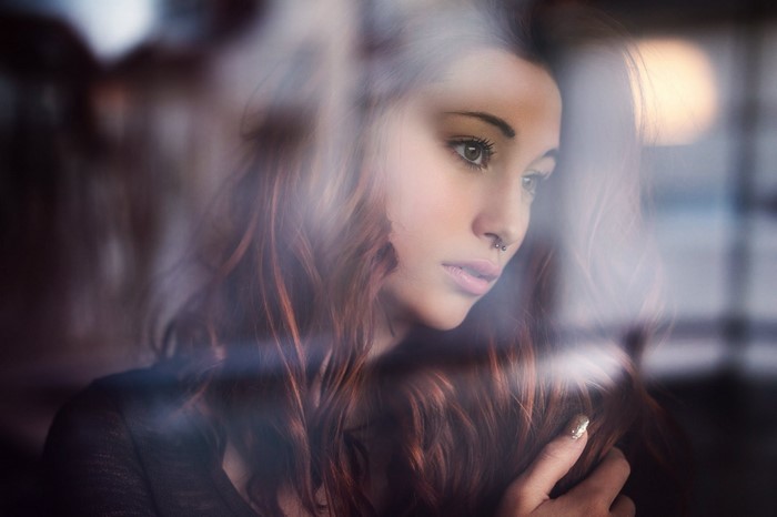 Woman with nose ring and long brown hair
