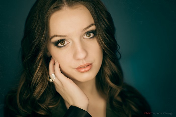 Close-up portrait of a young woman with brown hair