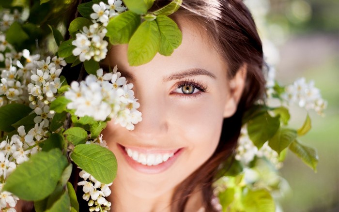 Woman with cherry blossoms in her hair