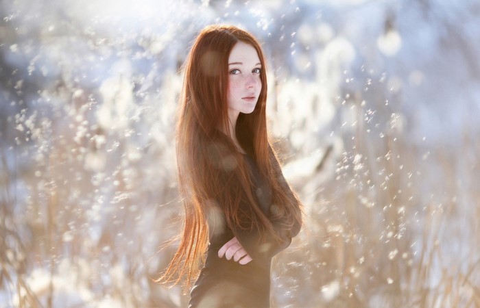 Redhead Woman in Black Dress Amid Winter Nature