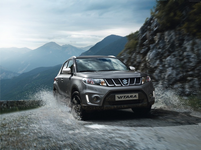 Suzuki Vitara S driving through water in mountains