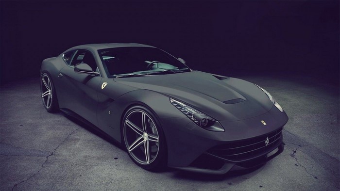 Matte black Ferrari F12berlinetta parked on concrete
