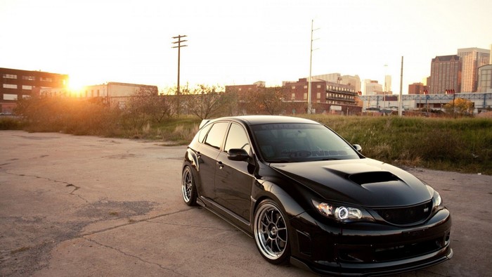 Black Subaru Impreza WRX STI hatchback parked outdoors