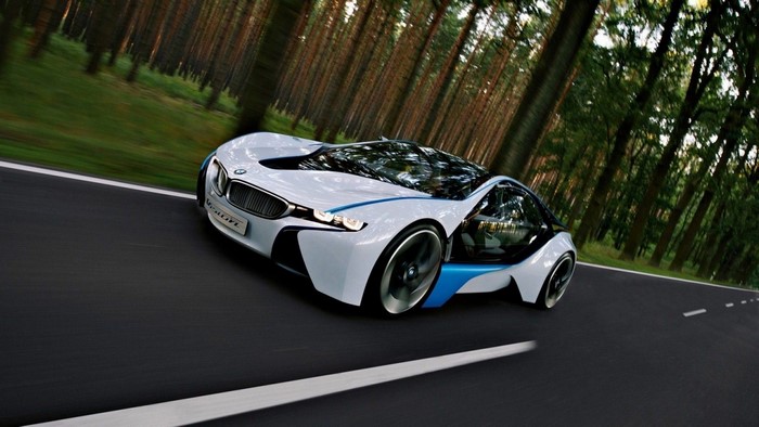 BMW Vision EfficientDynamics concept car driving on a forest road