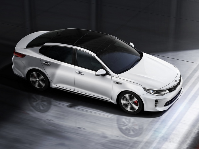 White Kia Optima GT sports car with black roof
