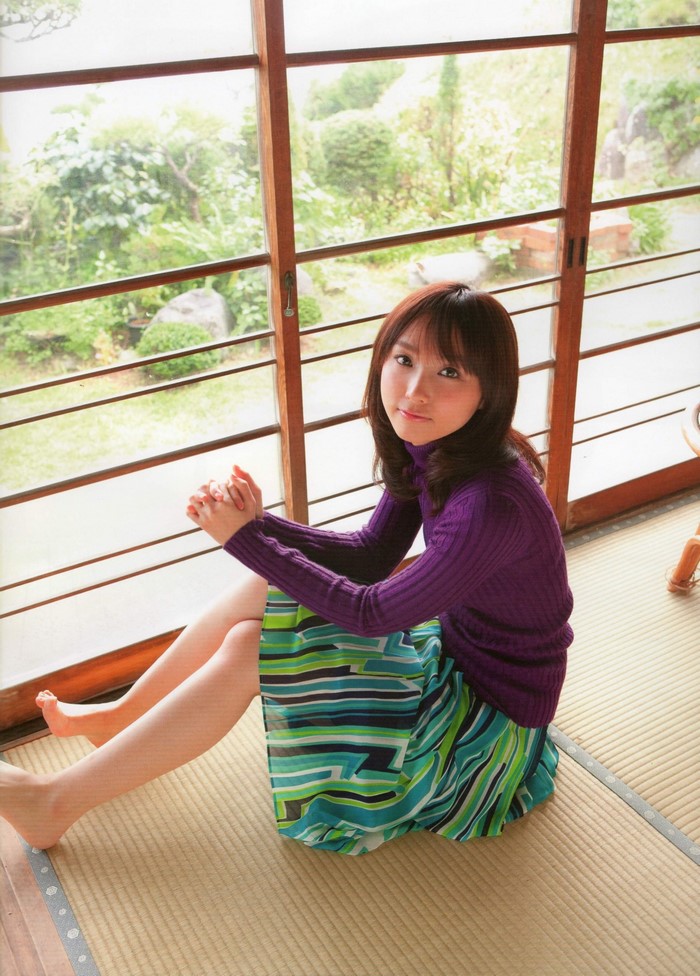 Risa Yoshiki sitting by a window