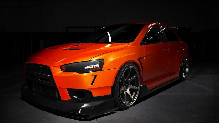 Orange Mitsubishi Lancer Evolution with custom body kit