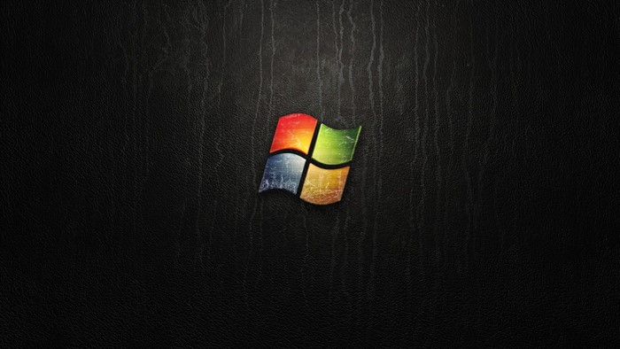 Windows Vista logo on black textured background