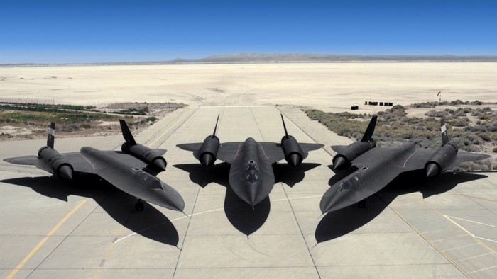 Three Lockheed SR-71 Blackbird aircraft on a runway