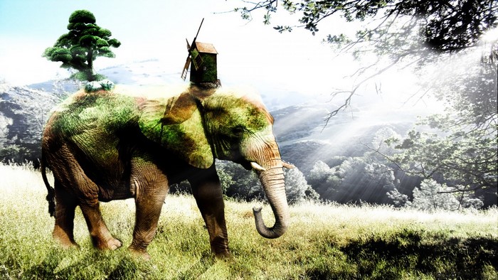 Elephant with a tree and windmill on its back