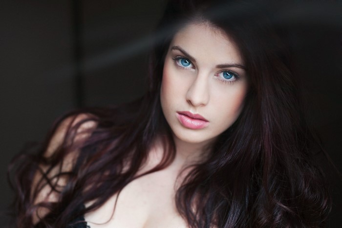 Close-up Portrait of Woman with Blue Eyes and Long Hair