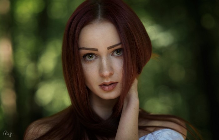 Portrait of a young woman with red hair