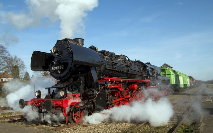 Steam locomotive 52 8060-7 with freight cars
