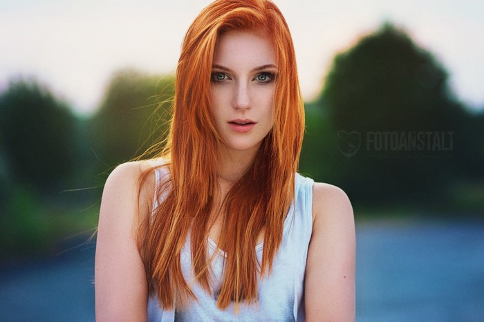 Portrait of a Redhead Woman with Green Eyes