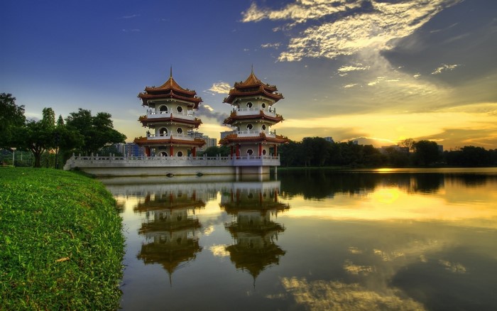 Twin Pagodas Reflecting in a Lake at Sunset