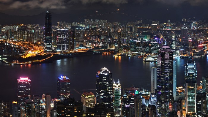 Hong Kong cityscape at night with illuminated skyscrapers