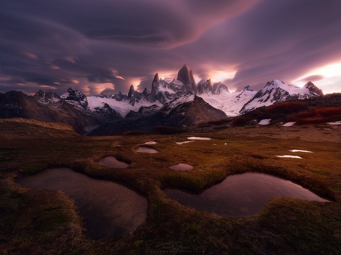 Fitz Roy mountain range at sunset with pools in foreground