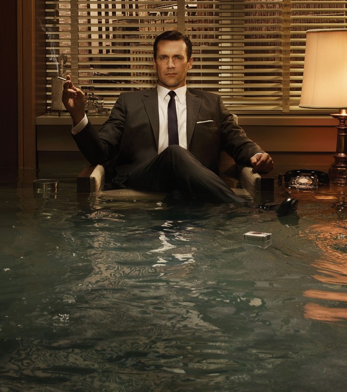 Don Draper from Mad Men sitting in a flooded office