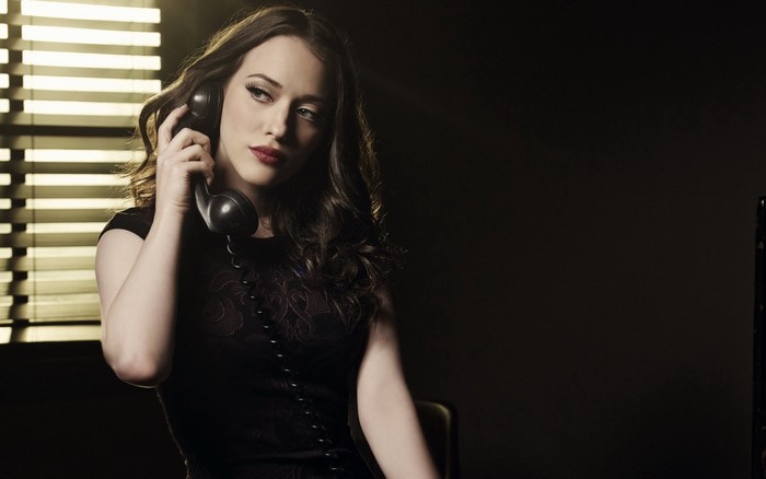 Kat Dennings holding a phone