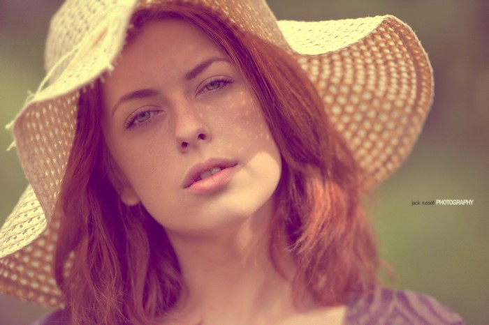 Woman wearing a straw hat, portrait photography