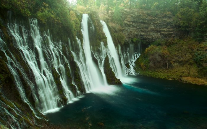 Burney Falls waterfall in a forest with blue water