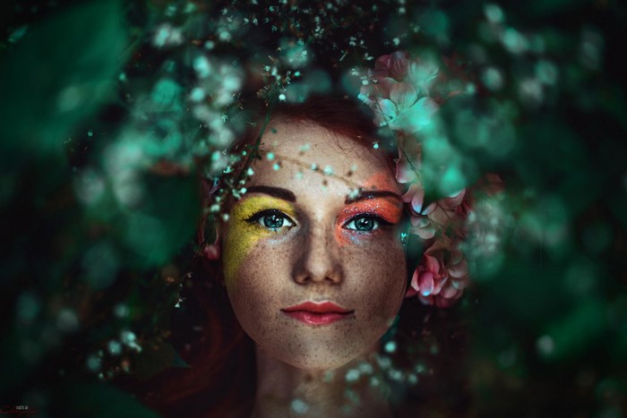 Woman with colorful makeup and flowers