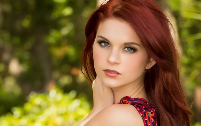 Portrait of a Redhead Woman with Long Hair