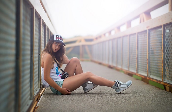 Model Sitting on Bridge Wearing Casual Summer Outfit