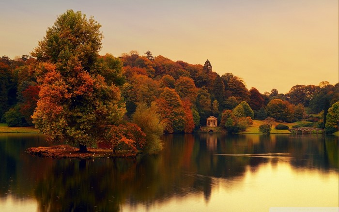 Autumn landscape with lake and classical temple