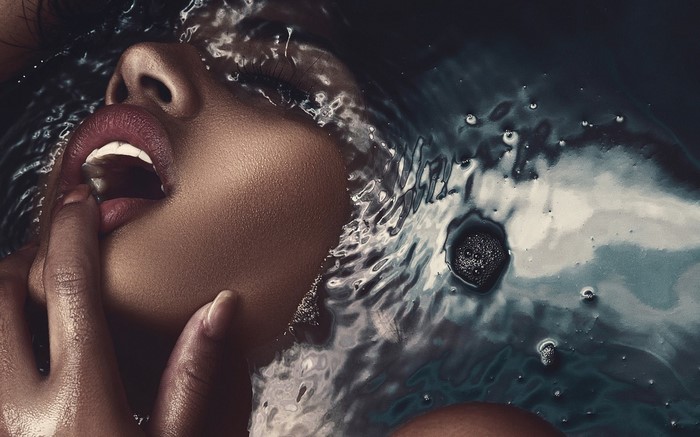 Close up of a woman's face in water