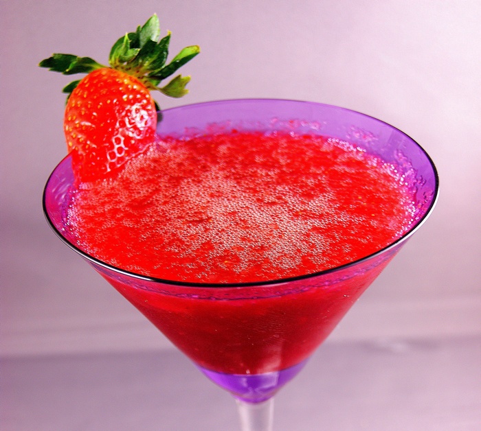 Strawberry daiquiri in a purple martini glass