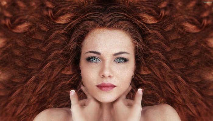Woman with long red hair and freckles