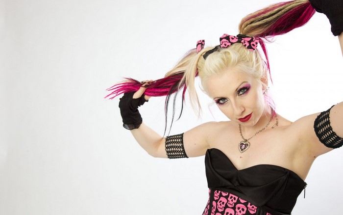 Woman with pink and blonde pigtails and skull corset