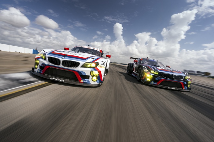 Two BMW M Power race cars on a track