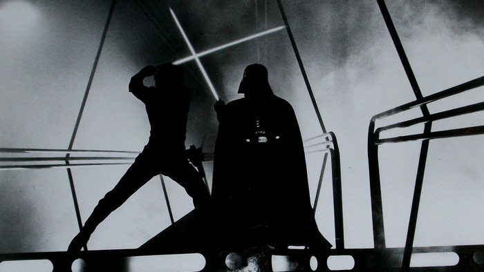 Darth Vader and Luke Skywalker duel with lightsabers