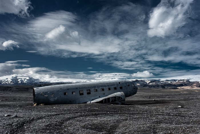 Abandoned airplane wreck on a rocky landscape in Iceland