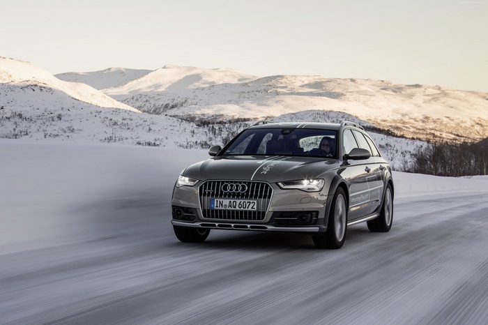 Audi A6 allroad Quattro driving on snow