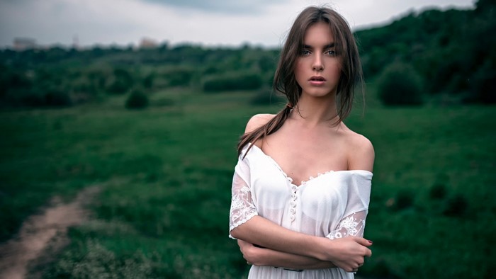 Woman in white dress in a field