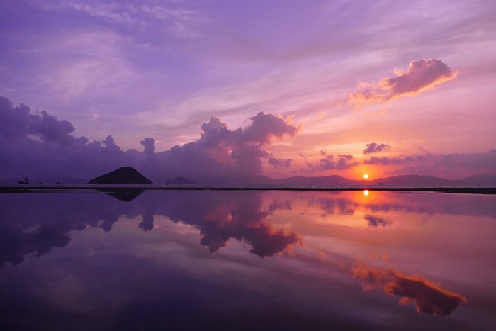 Sunset over the sea with reflection