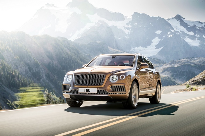 Bentley Bentayga driving on a mountain road