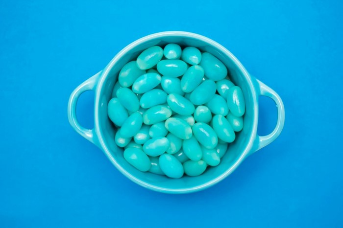 Turquoise jelly beans in a blue bowl