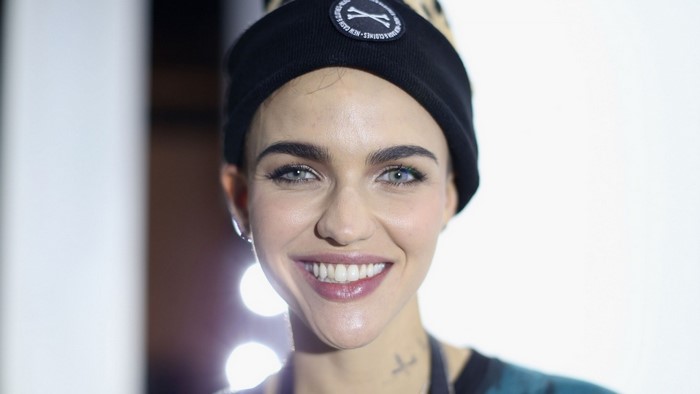 Ruby Rose wearing a beanie and smiling