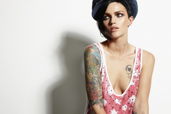 Ruby Rose with tattoos wearing a patterned tank top