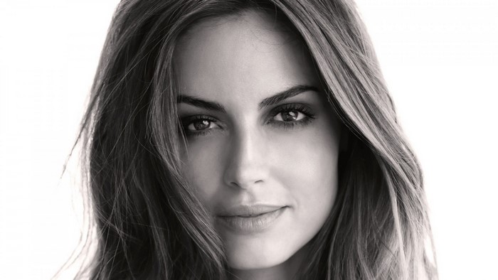 Monochrome portrait of a woman with long brown hair