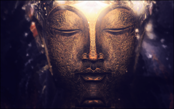 Close-up of a golden Buddha statue with bokeh background